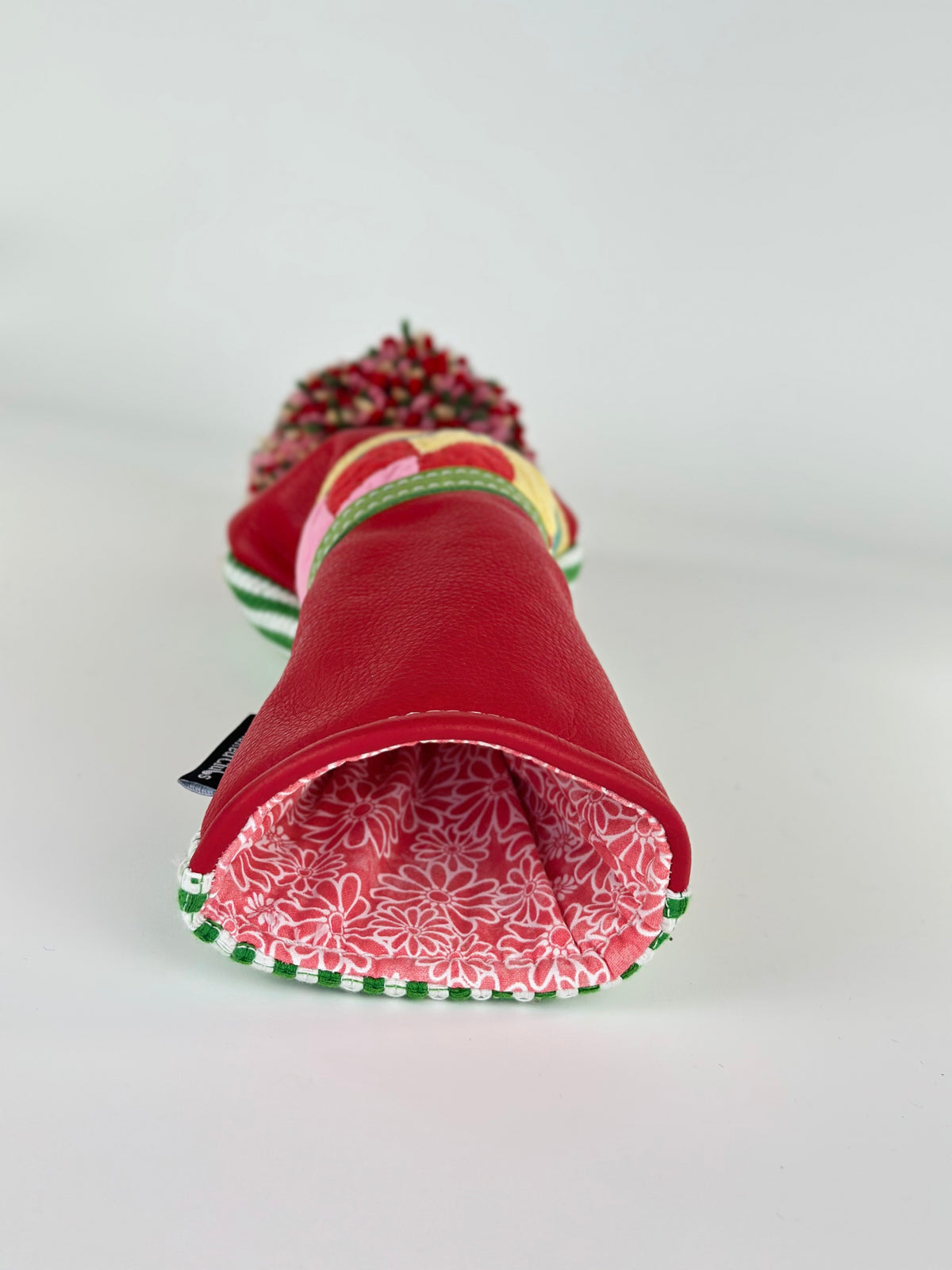 Cherry Picnic red leather fairway headcover showing vintage floral fabric lining
